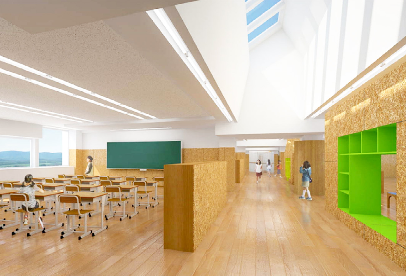 教室の間仕切りや廊下は木質化されており、廊下の天井は高く高窓が設置されている。